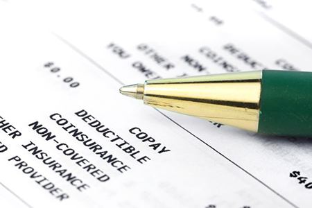 Close-up of insurance document with pen