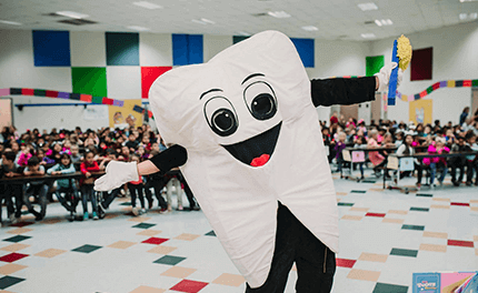 Tooth mascot at community event