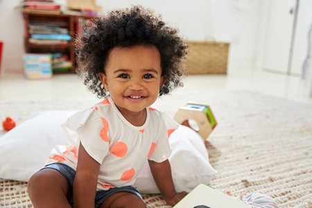 Smiling, happy toddler after frenectomy treatment
