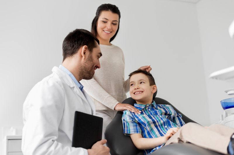 A mother and son visiting a child dentist in Kaufman.